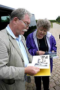 Joy Erickson reviews family history with a resident of her ancestral town in Germany.
