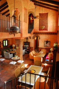 The lovely Hotel Alavera de los Baños below Ronda, Spain. The interior lounge is used for breakfast and for two tour guides from America, as a second living room for two days and nights.