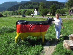 Gloria Temple with a German dairy cow during her ancestral trip along with her husband Ken, September, 2013 in the Black Forest of Germany.