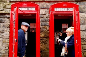 Having fun in a couple of the typical red phone booths near Edinburgh castle